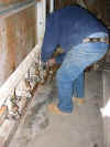 Trevor Corser wrestles with the kiln at the Leach pottery, St. Ives, Cornwall 1