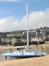 Catamaran beached in the harbour, St. Ives, Cornwall